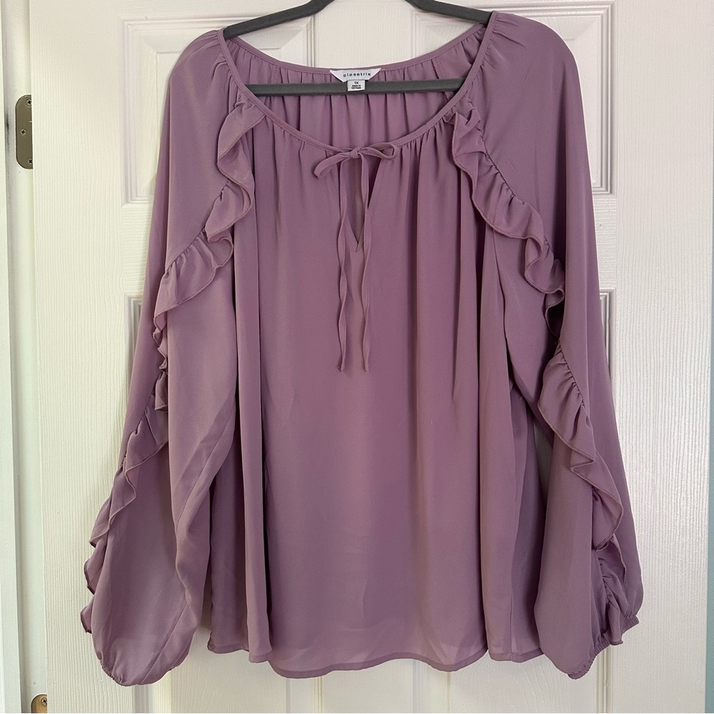 1X flowing lavender long-sleeve blouse w/ tie neck and ruffles along sleeves
